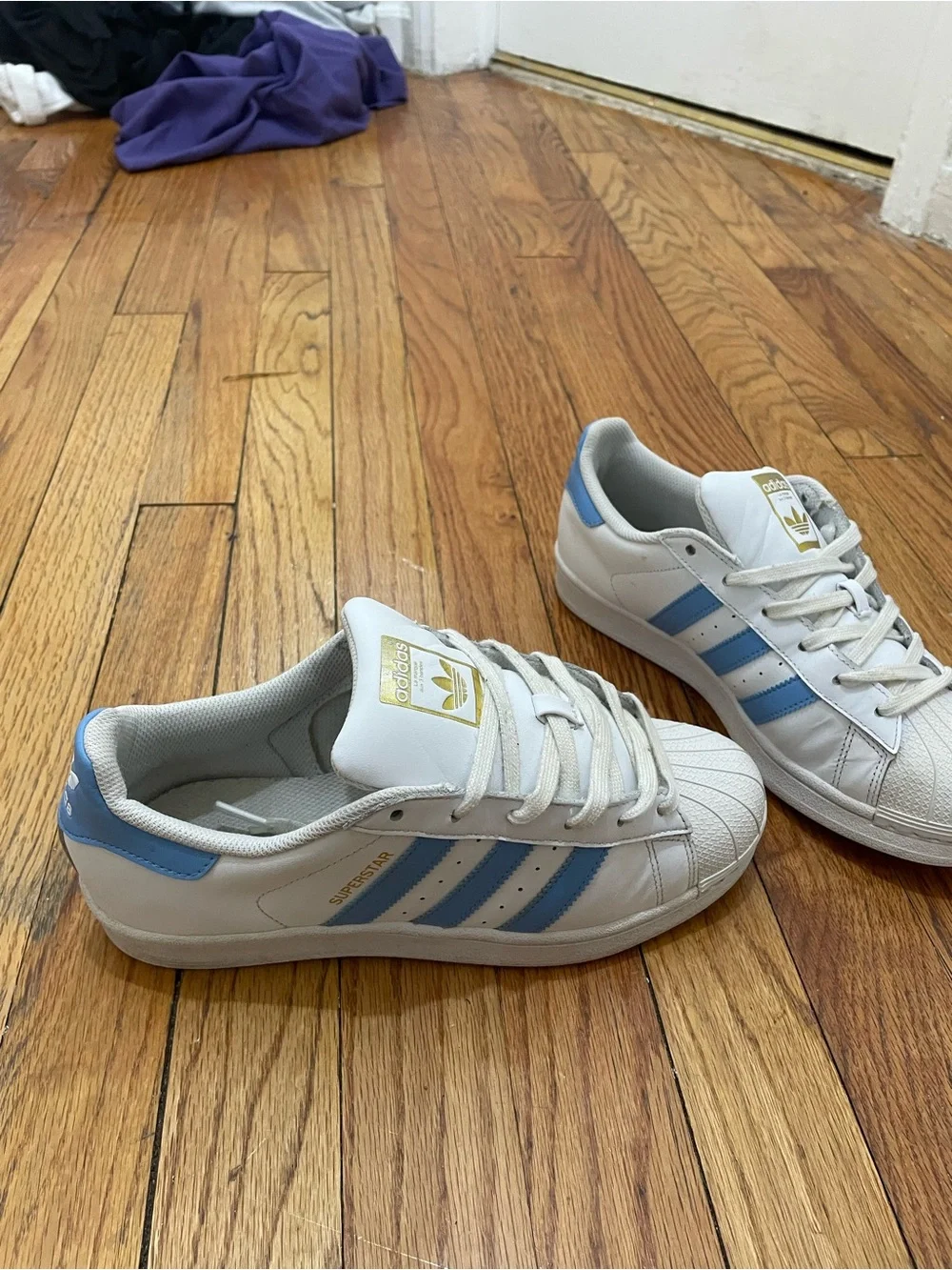 adidas Superstar Men’s Sneakers in White with Light Blue Stripes